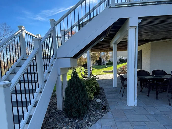 Residential hardscape creation with under deck and subsurface drainage renovation, landscape creation and low voltage lighting addition project in Jamison, PA